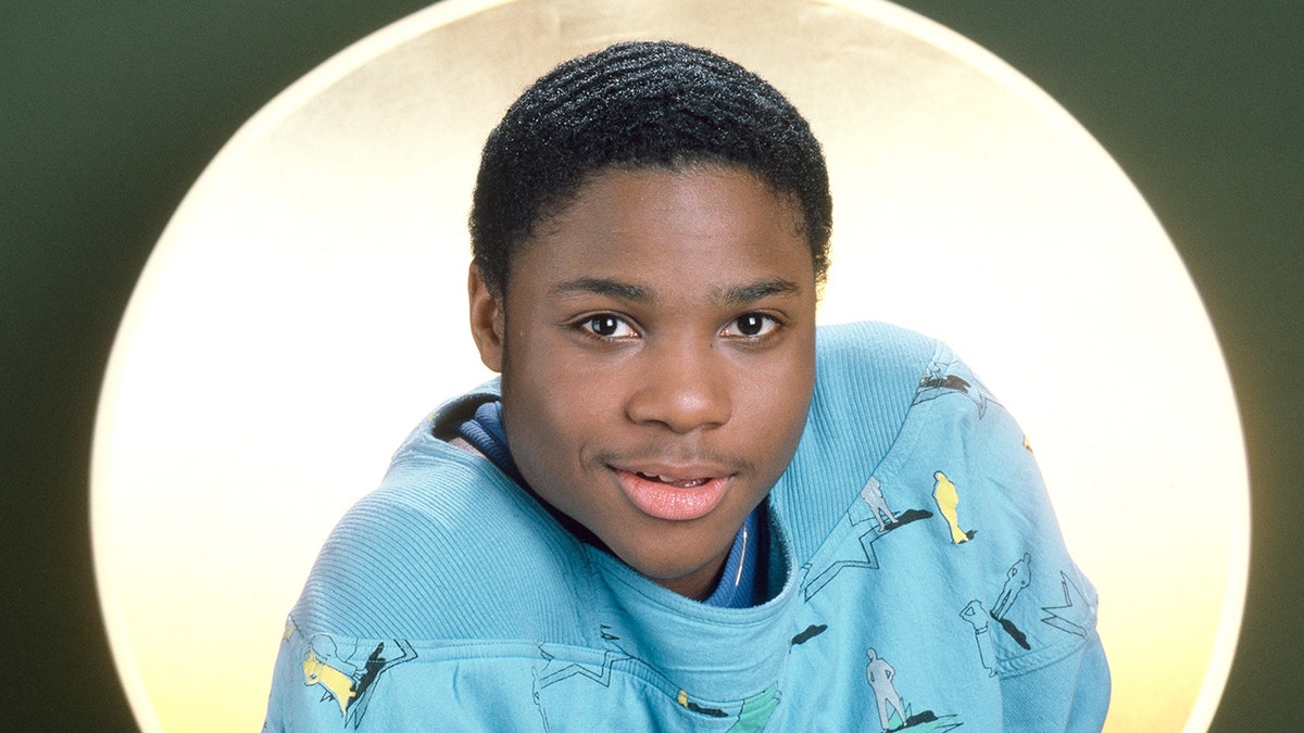 Malcolm-Jamal Warner wears blue sweater
