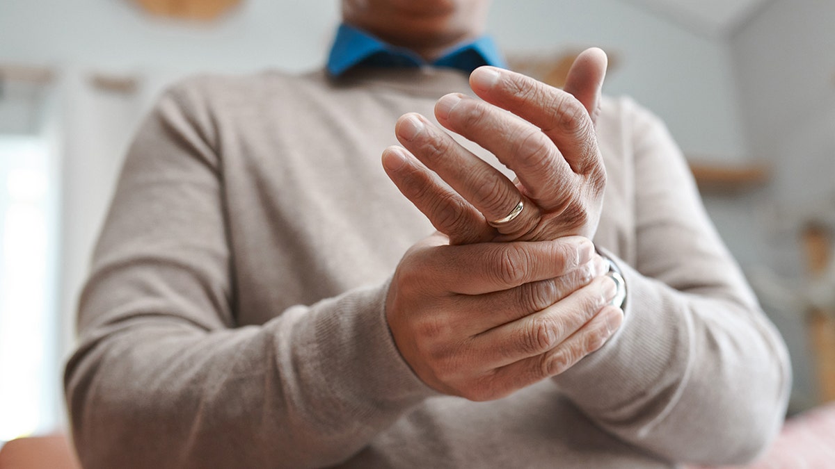 man with hand pain
