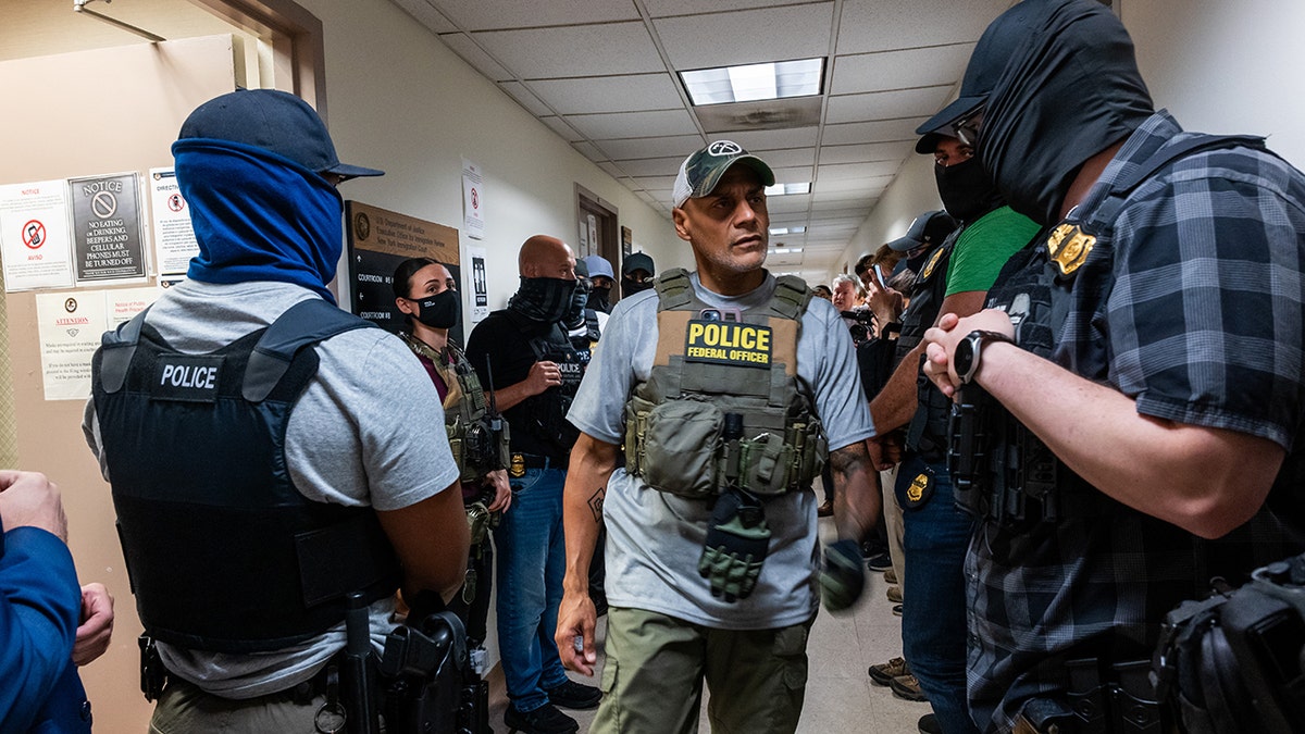 Federal agents in the corridor of the New York Federal Justice Palace
