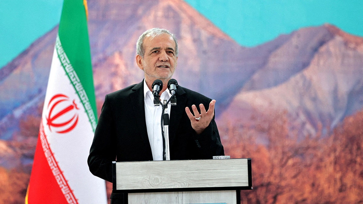 Iranian President Masoud Pezeshkian speaking astatine a podium successful beforehand of Iranian flag