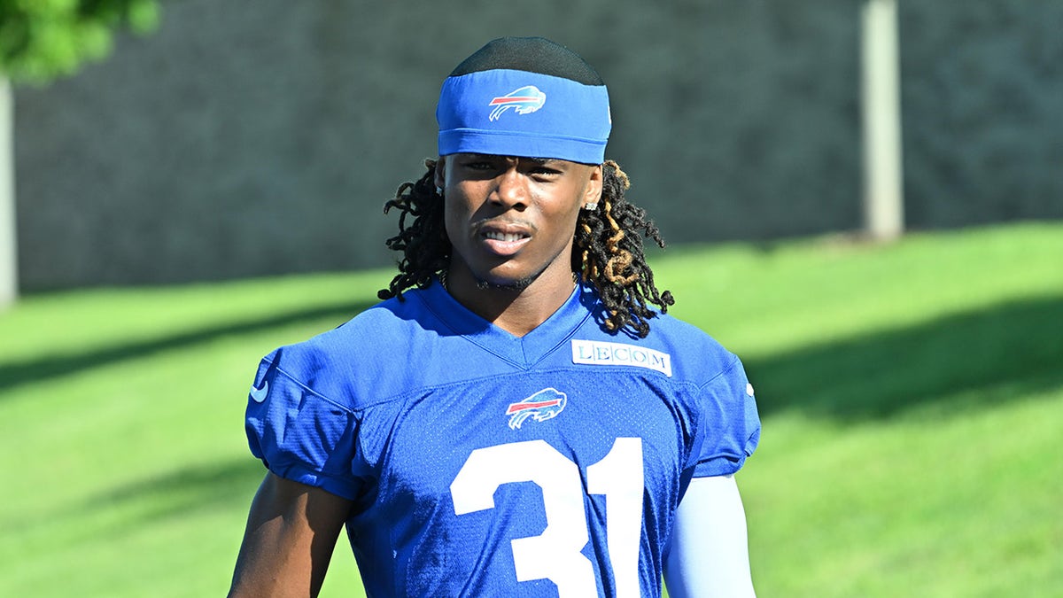 Maxwell Hairston looks on field