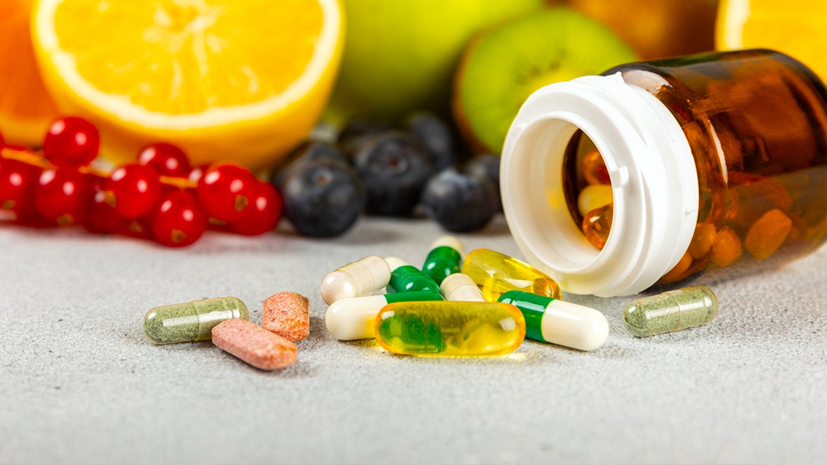 Image of pills near foods