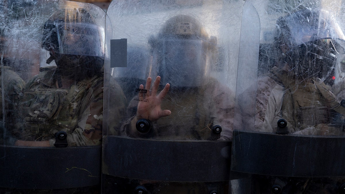 National Guard line their shields in LA