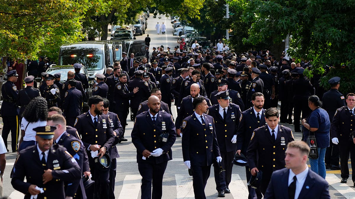 New York Police officers gather outside mosque