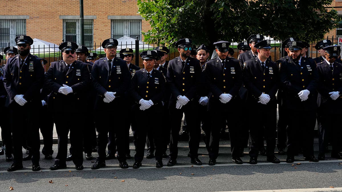 New York Police officers gather outside mosque