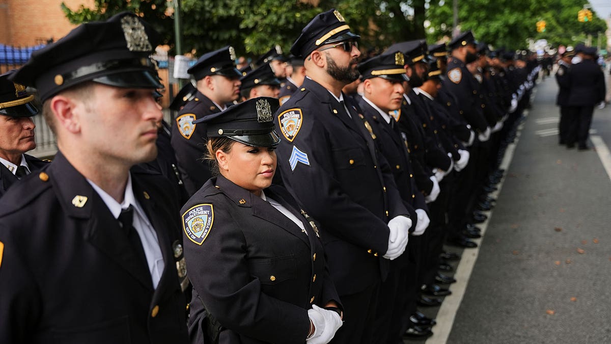 New York Police officers gather outside mosque