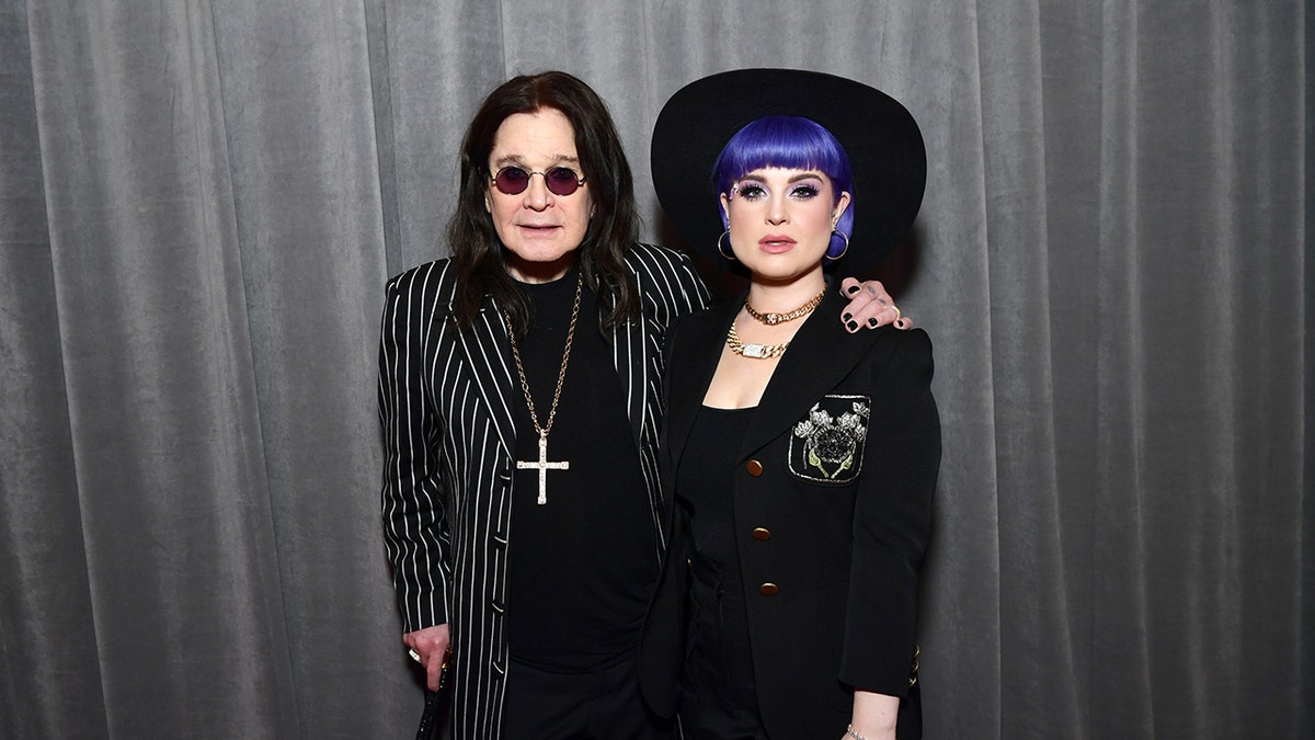 Ozzy Osbourne and Kelly posing together at the Grammy Awards.