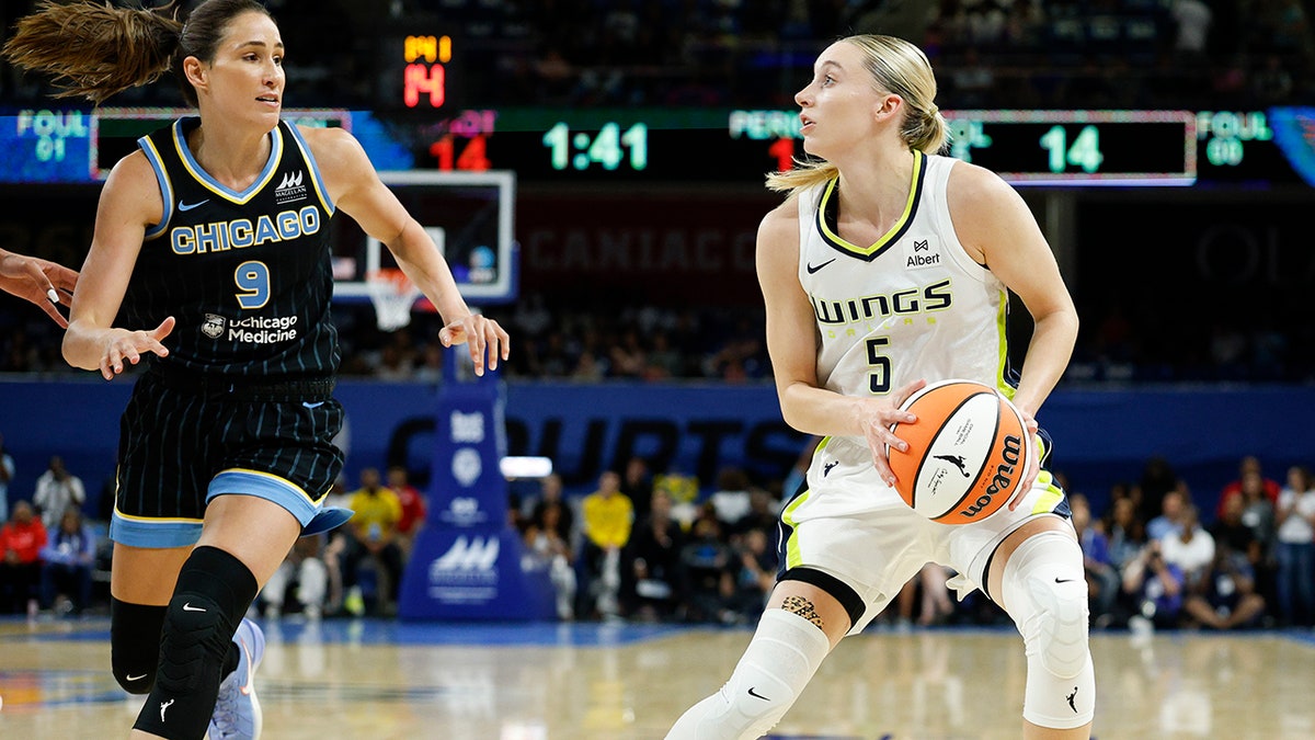 Dallas Wings defender Paige Bueckers, #5, looks to sprout against Chicago Sky defender Rebecca Allen, #9, during nan first half astatine Wintrust Arena connected July 9, 2025.