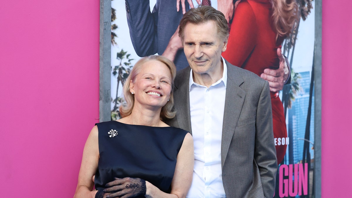 Pamela Anderson and Liam Neeson at a movie premiere