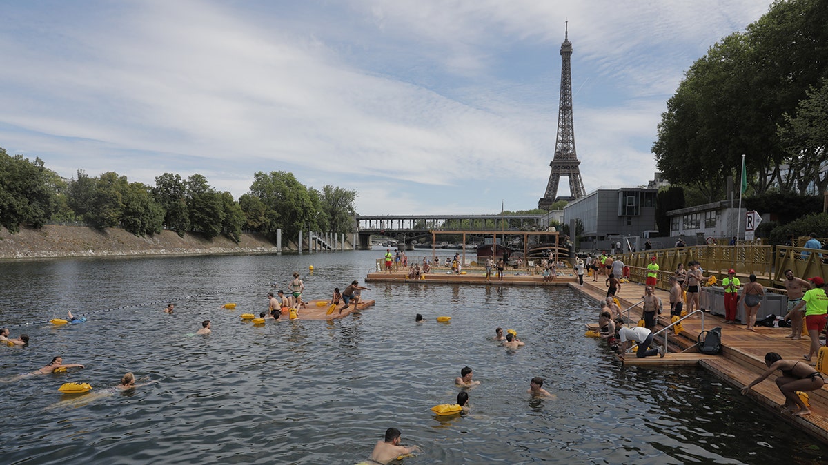 swimmers dip in the seine river in paris