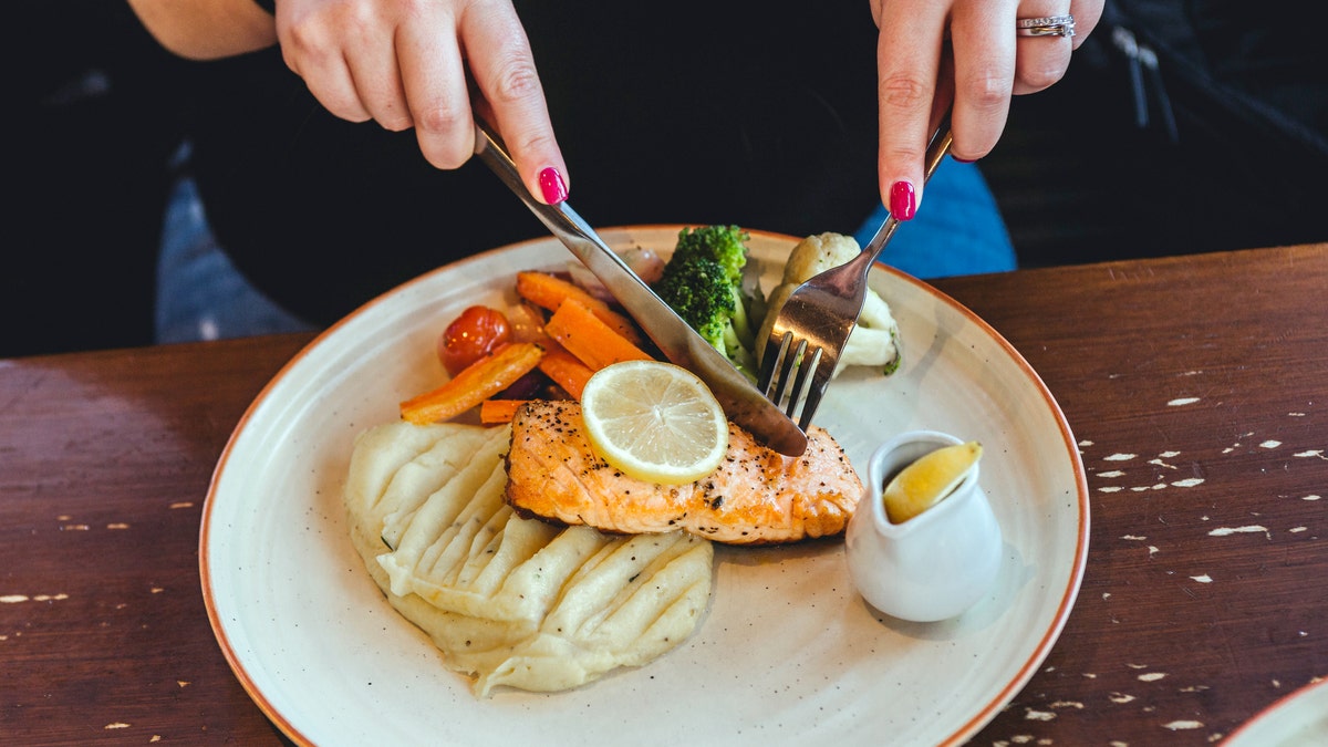 Person cutting food