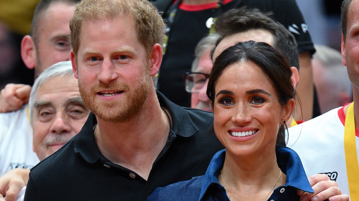 Peince Harry and Meghan Markle smiling