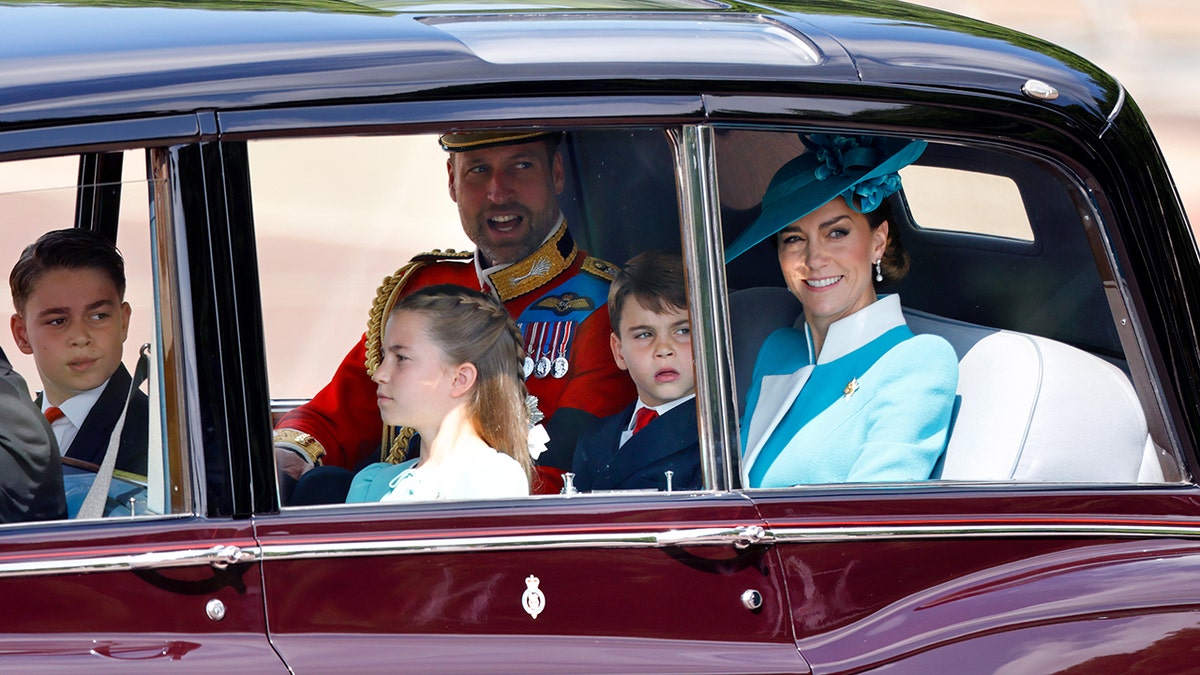 The Wales family sits in a car together in official clothes.