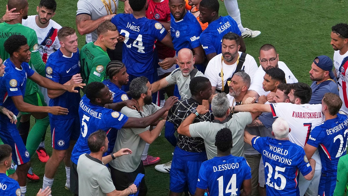 Paris Saint-Germain players and Chelsea players scuffle