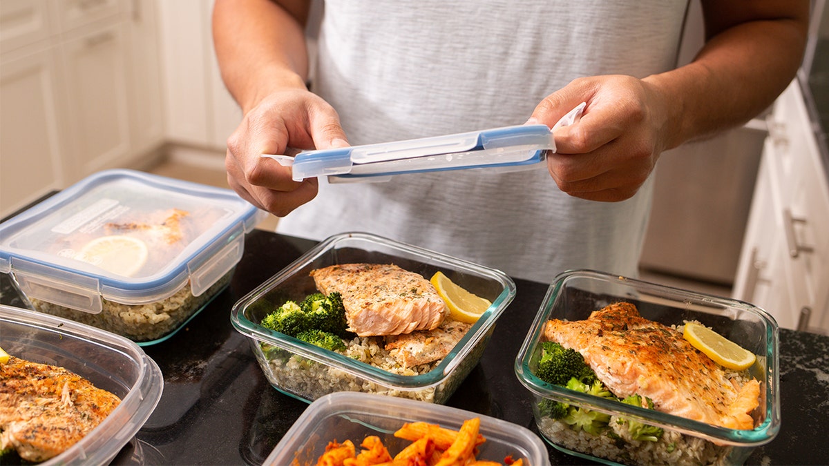 Man meal prepped salmon