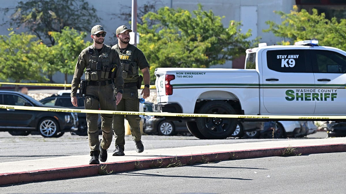 Police officers at the scene of a shooting outside a casino.