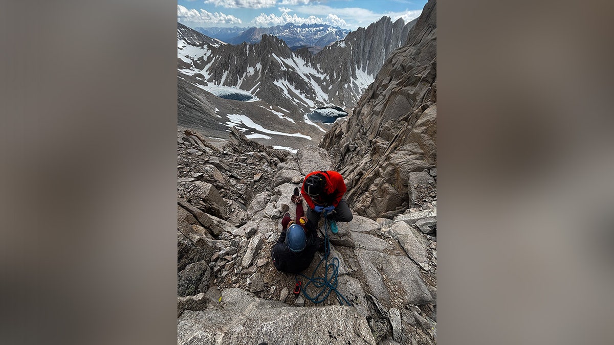 Female hiker receiving aide after falling from Mt. Williamson.