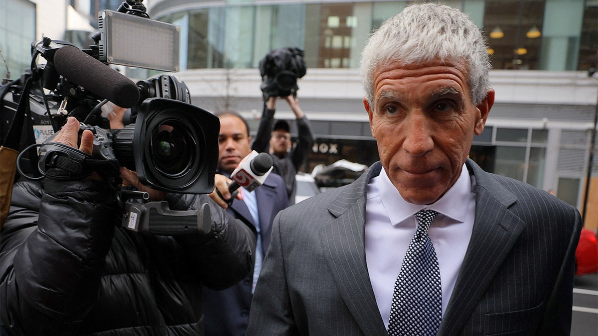 Rick Singer arrives at the court