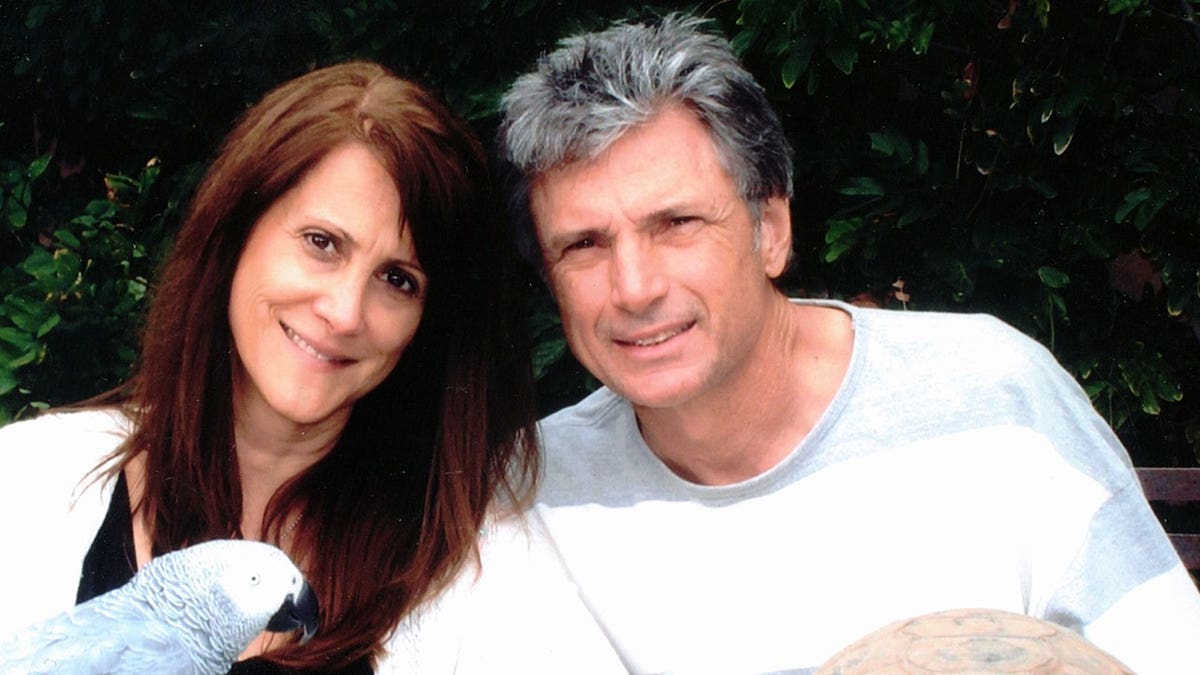 Robin Kaye and husband Thomas Deluca smiling in photo shared on Facebook