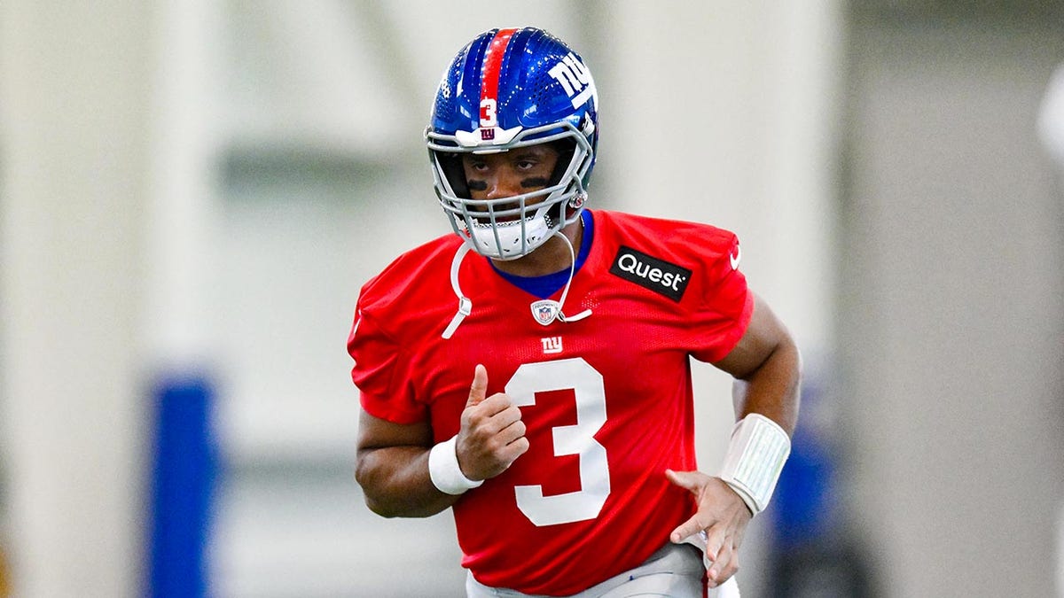 Russell Wilson looks on