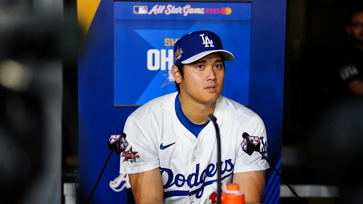 Shohei Ohtani speaks to the media