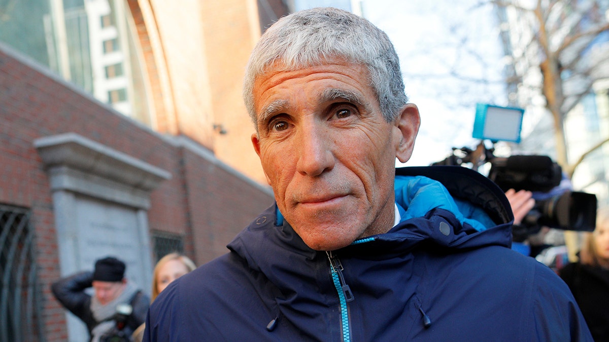 Rick Singer is outside the court