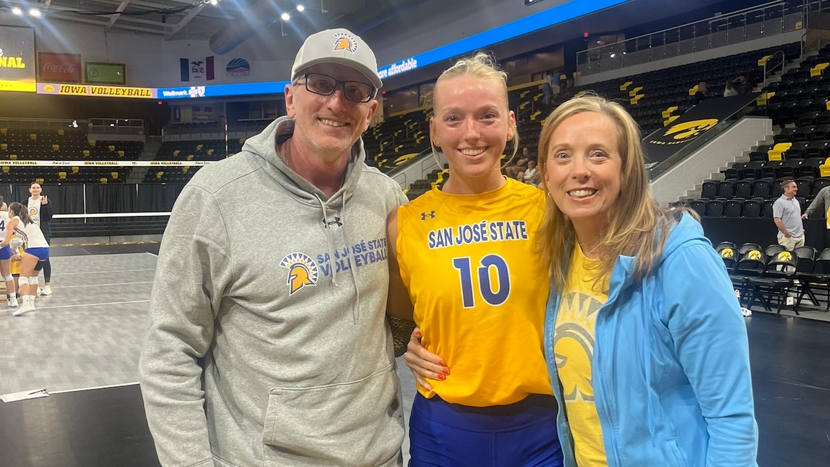 Former SJSU volleyball star Brooke Slusser and her parents Paul and Kim Slusser at a game on Sept. 8, which Kim claims is "the last fond memory we have of her playing."