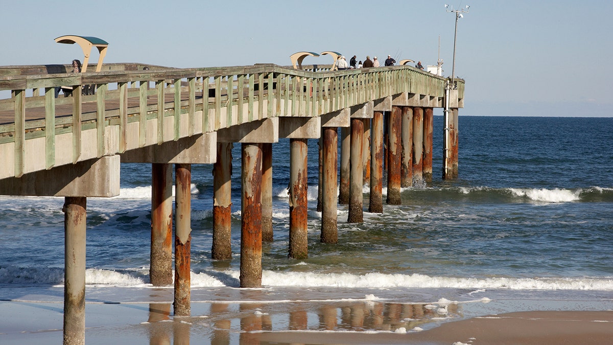 People walk on St. Augustine Pier