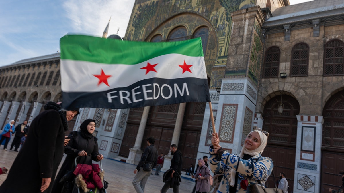 Syrian celebrates the reversal of Assad