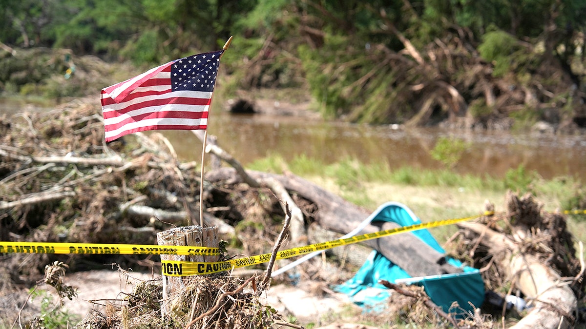 USA flag flying after deadly floods hit south central Texas.