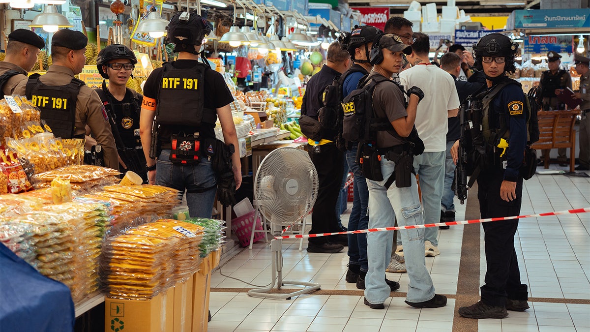 police on scene after deadly shooting at bangkok market