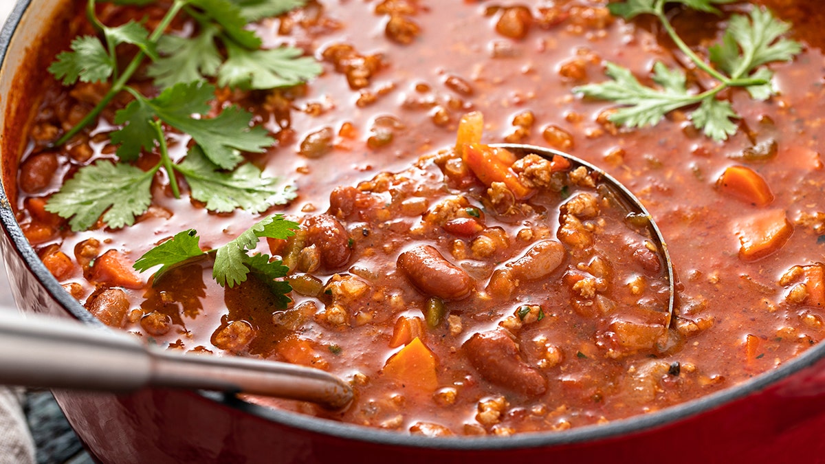 Photo of ladle in chili pot