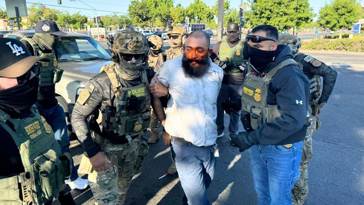 A man being arrested by Border Patrol