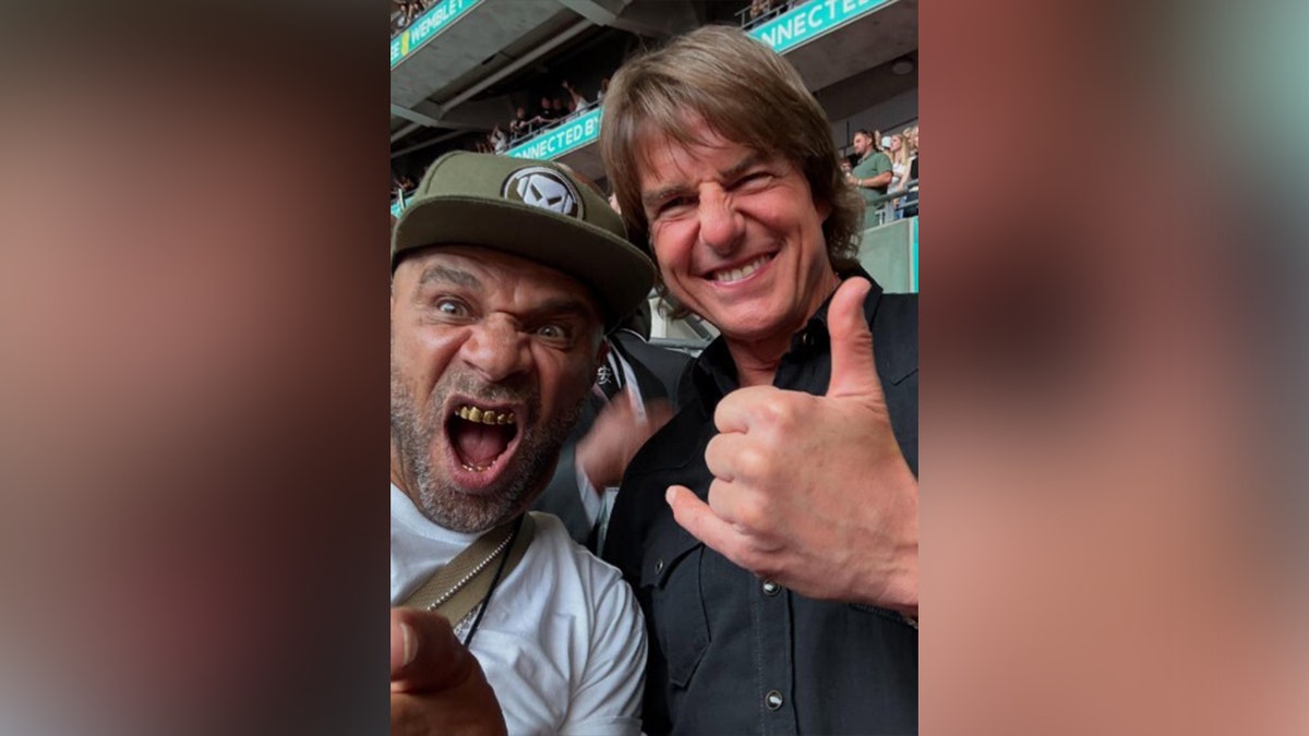 Tom Cruise watches Oasis with Goldie.