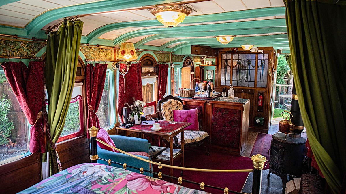 Nigel Brooke who lives in old railway station in Delph, Saddleworth, has refurbised an old classic train carriage in his garden and turned it into an Airbnb. See SWNS copy. 11/07/25