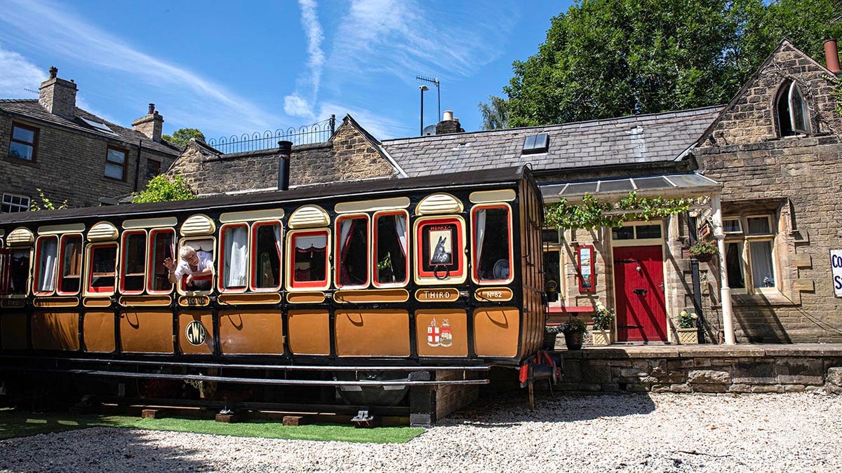 Nigel Brooke who lives in old railway station in Delph, Saddleworth, has refurbised an old classic train carriage in his garden and turned it into an Airbnb. See SWNS copy. 11/07/25