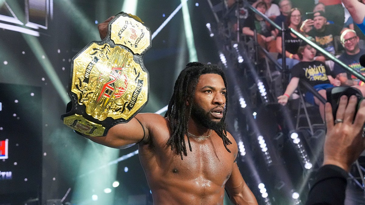 Trick Williams with the TNA title