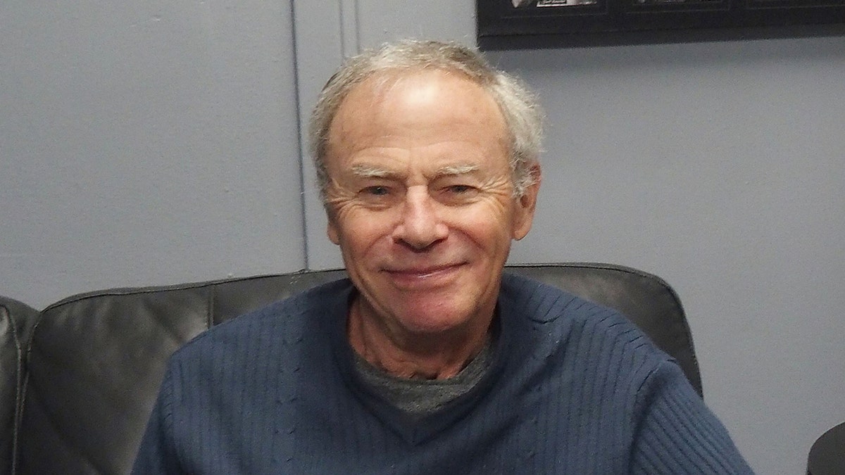 Tristan Rogers wears blue sweater