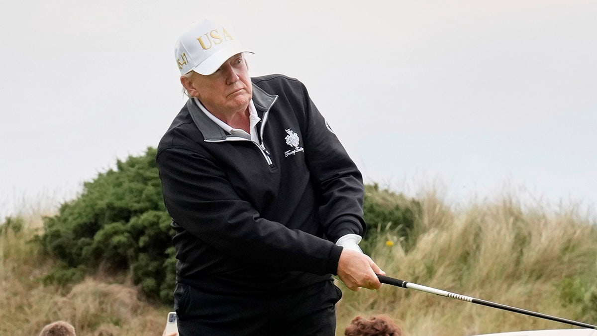 Trump golfs in Scotland
