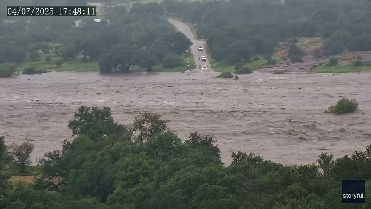 floodwaters completely overwhelm street