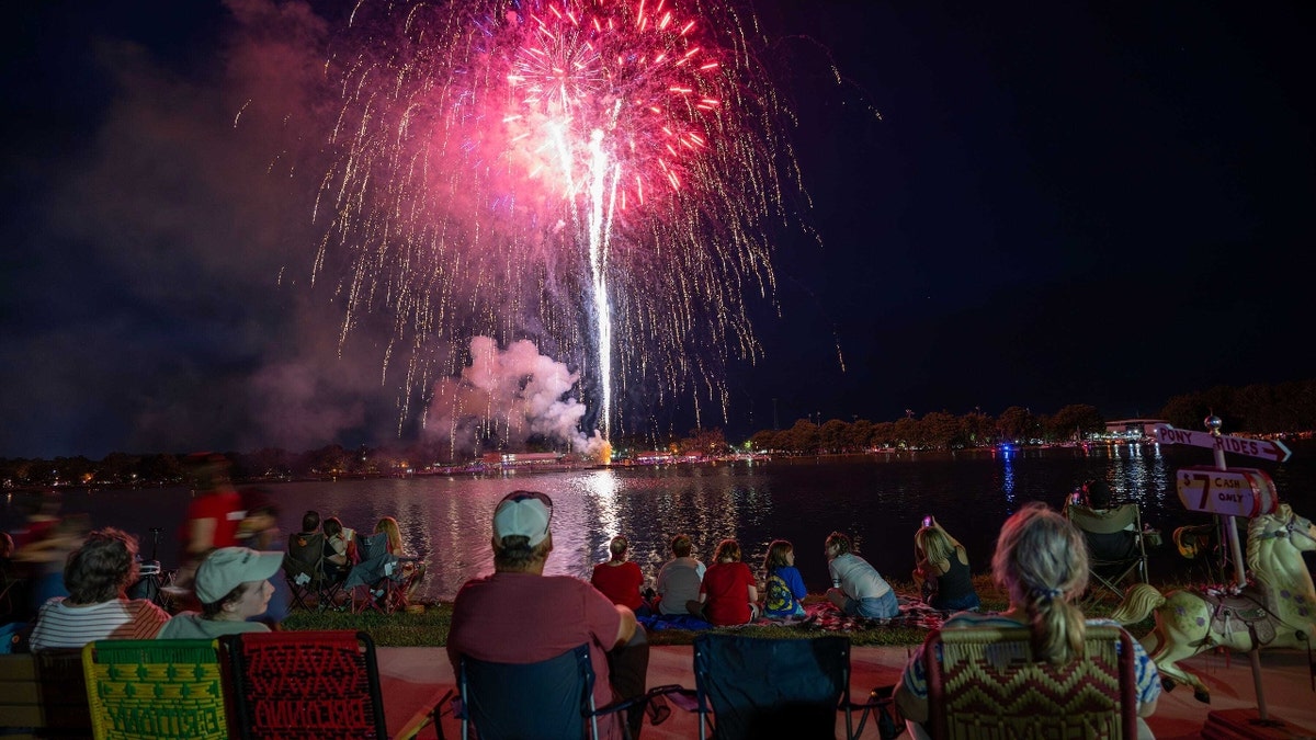 People watch fireworks on July Fourth