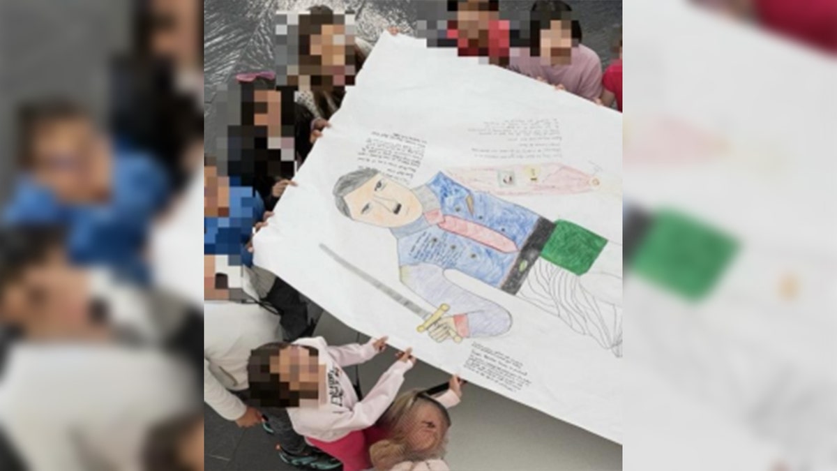 Hitler cartoon held by students at Nysmith School for the Gifted 