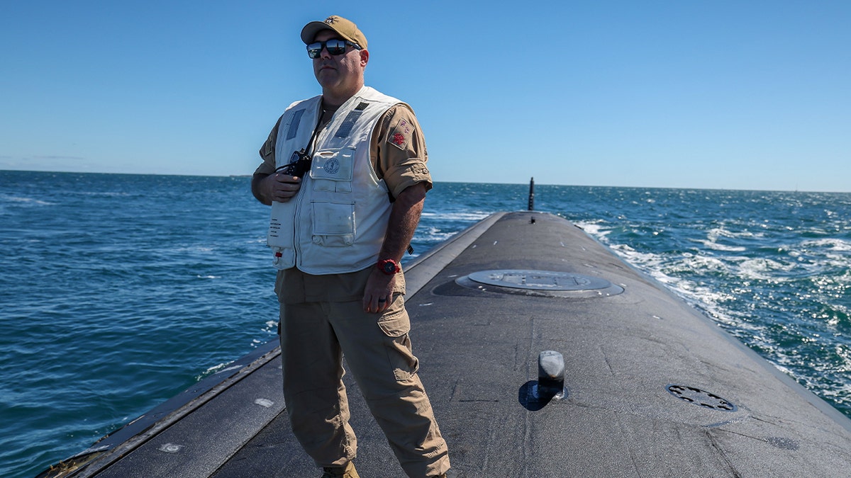 Master Chief Missile Technician Kevin Lewis, Minnesota Chief of the Boat stands on the stern of USS Minnesota (SSN-783) Virginia-class fast attack submarine in the waters off the West Australian coast on March 16, 2025 in at sea, West Australian coast. The submarine was on a port visit.