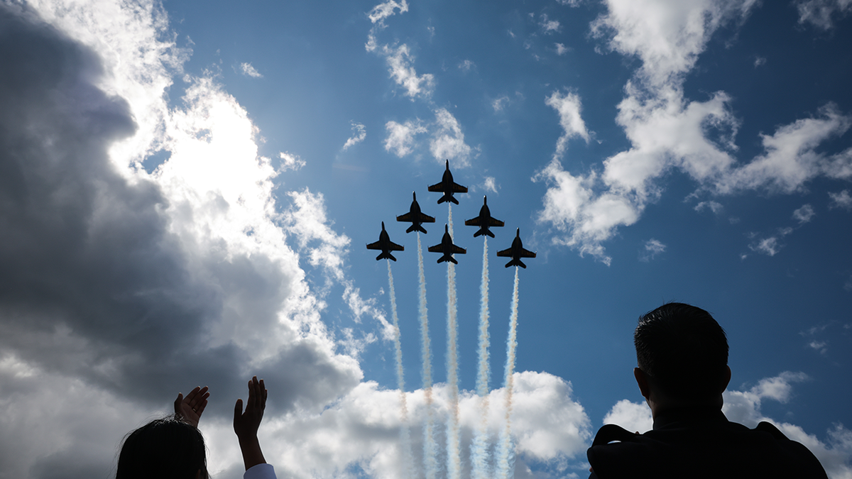 People watching air show