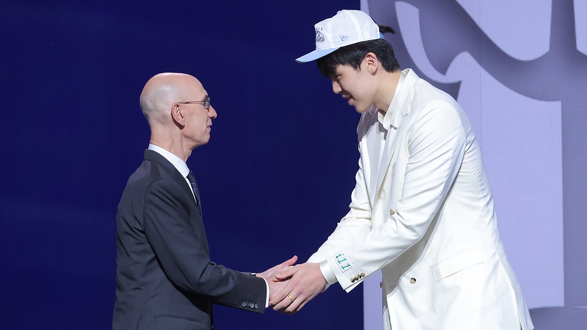 Yang Hansen and Adam Silver