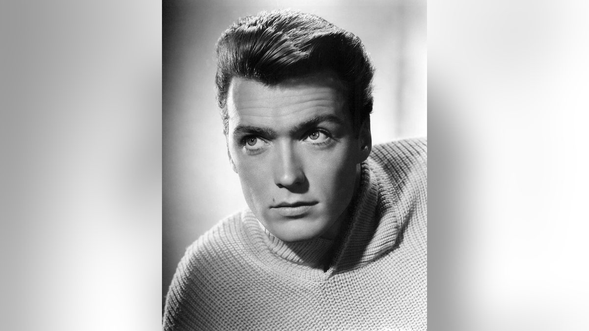 A young Clint Eastwood posing for a portrait.