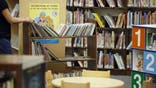 A librarian shelves books in the children's section at the City of Santa Clarita Public Library Valencia branch in Santa Clarita, California, U.S., on Sunday, Nov. 1, 2015. Library Systems & Services LLC is running into opposition as it seeks to add the 24 libraries in Kern County, California, to its portfolio of 82 in six states, allowing the county to shed a unionized workforce of 118. The company's Valencia library in Santa Clarita bears no outward signs of being privately run. Photographer: Patrick T. Fallon/Bloomberg via Getty Images