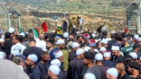 Israeli Druze in the Golan Heights mass along the Syrian border on July 16, 2025. Many breached the border in a bid to help their Syrian brethren, who have been locked in days of ethnic violence against Bedouins and the Syrian army.