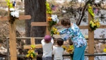 People leave flowers for victims of Texas floods