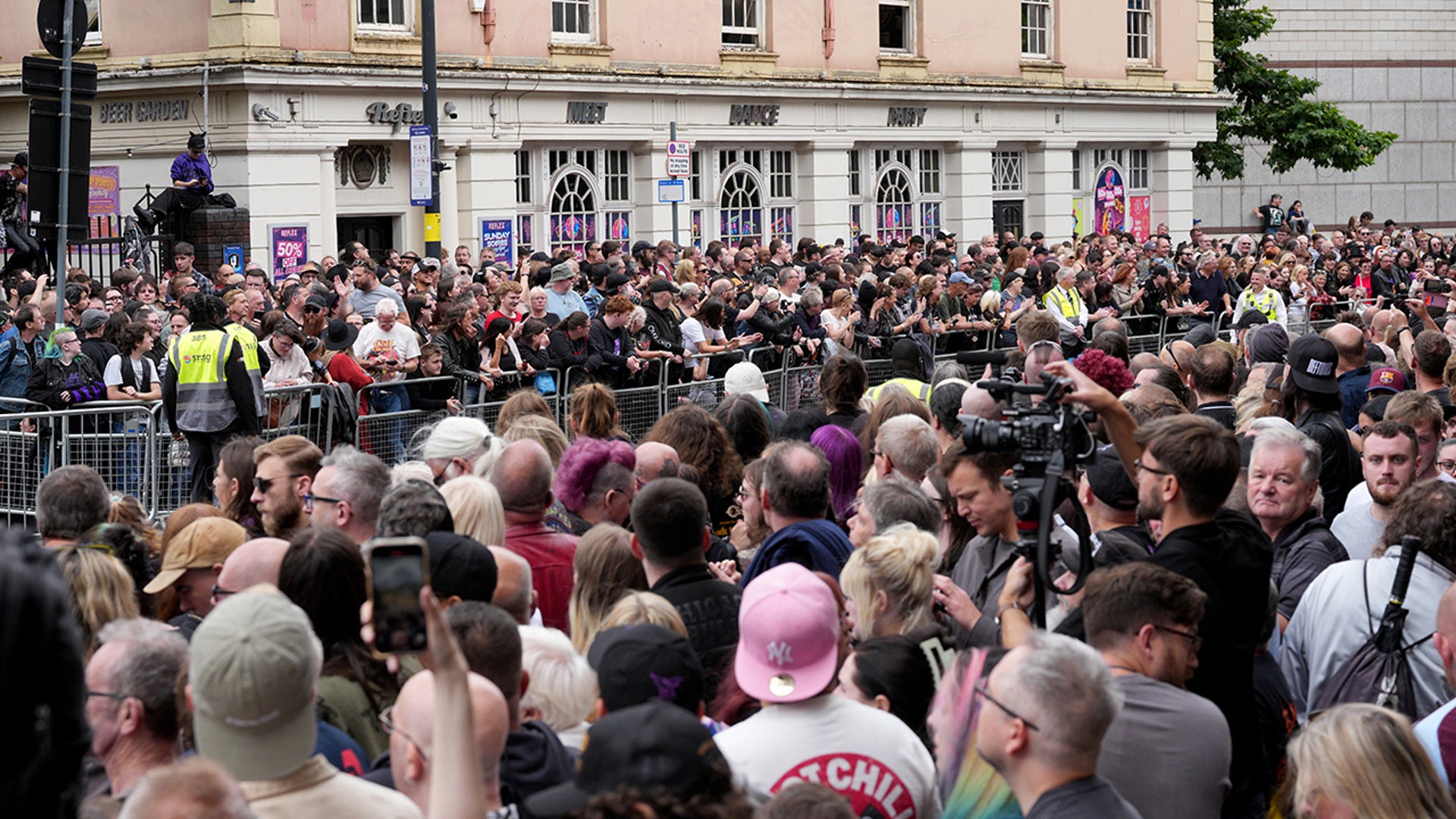 Fans gather to see Ozzy Osbourne's funeral cortège travel through his home city of Birmingham, England. His death occurred just a little over two weeks after his final live performance.